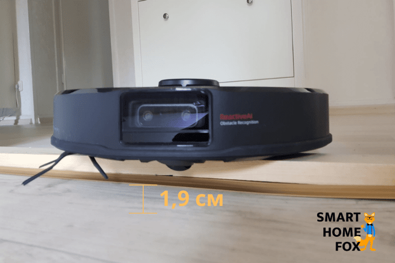 Roborock S6 MaxV vacuum cleaner robot overcomes a high doorstep.